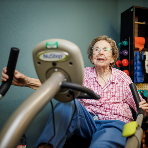 Female resident using our fitness machine
