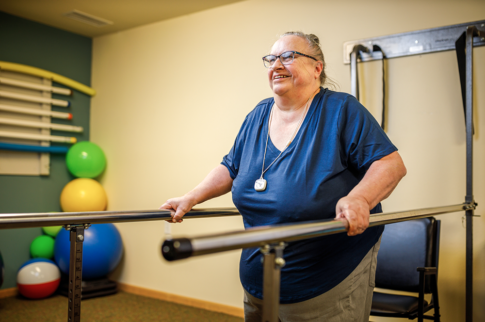 Female resident working out in the fitness room