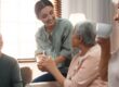 Team members helping seniors