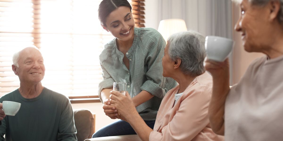 Team members helping seniors